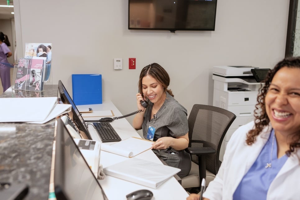 Nurse smiling while talking on the phone